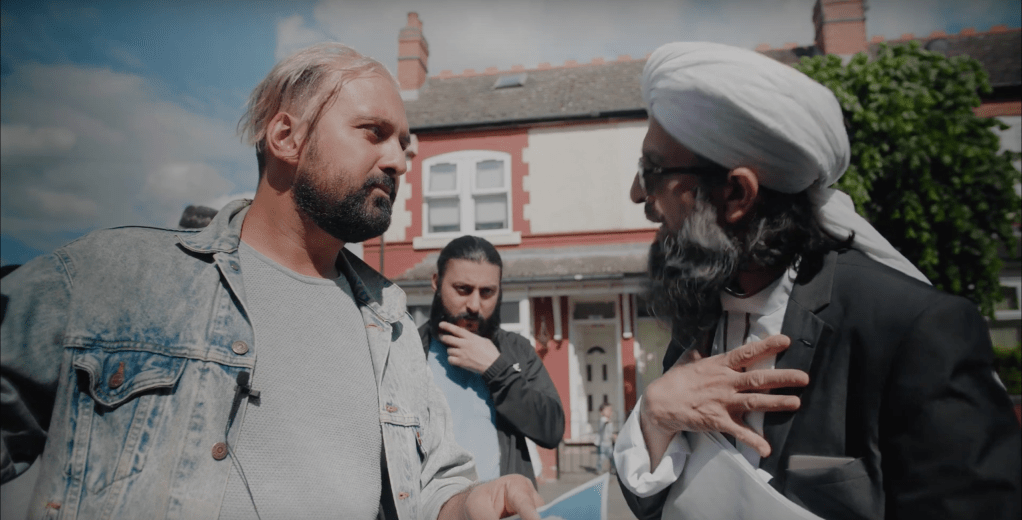 Ferhan Khan and a protester conversing
