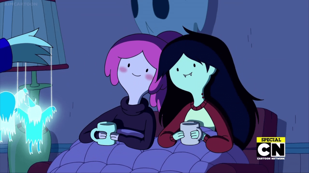 Bubblegum and Marceline cuddle up together under a blanket watching a show.