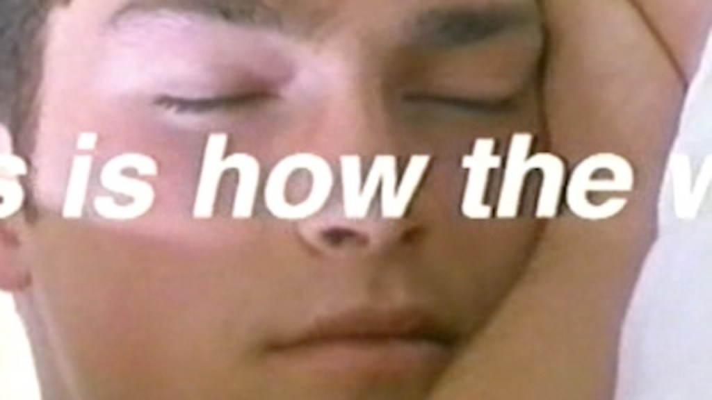 An image from TV Movie This is How the World Ends. A close up with a man asleep. The title is partially visible on his face.