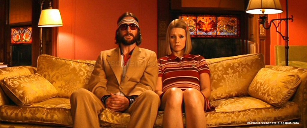 Screencapture from The Royal Tenenbaums. A man and a woman sit on a sofa. 
