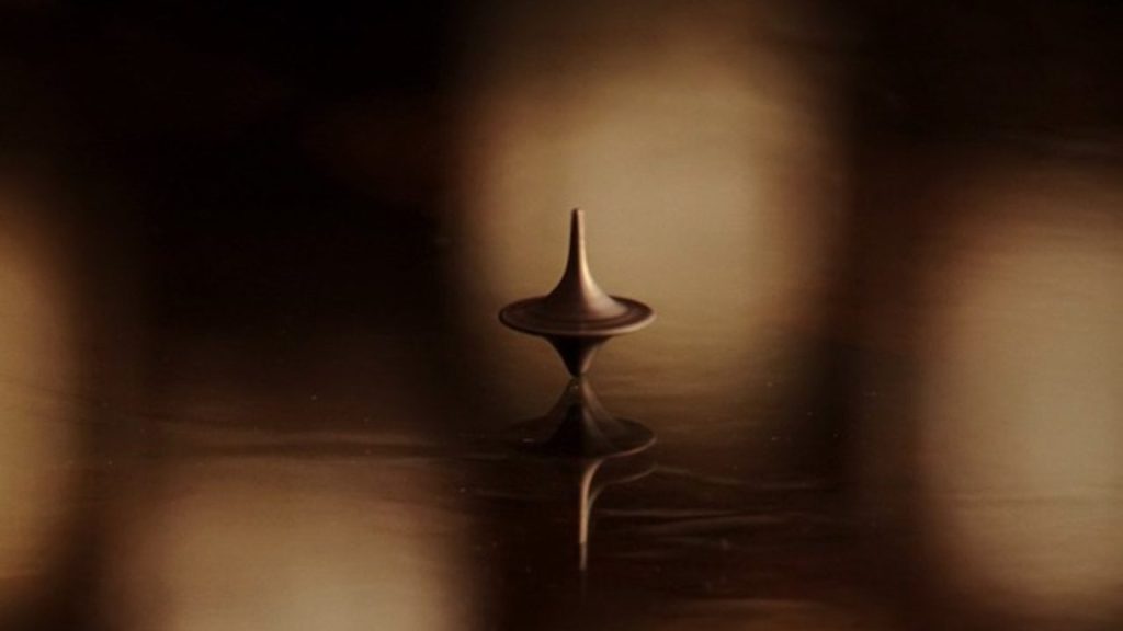 Dom’s spinning top, a token that helps him differentiate dreaming from reality