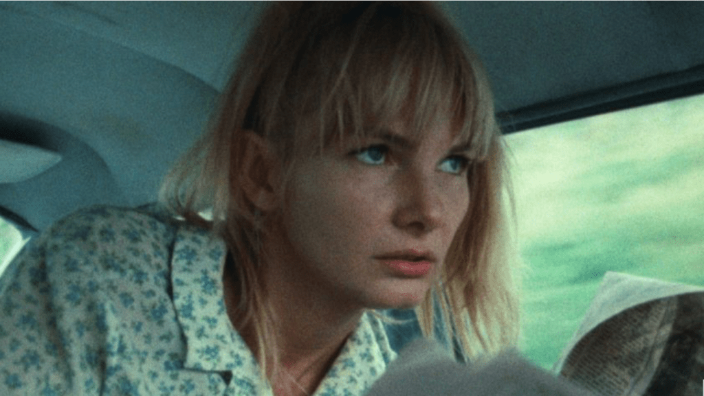 Wanda looks unhappy as she rides with Mr. Dennis