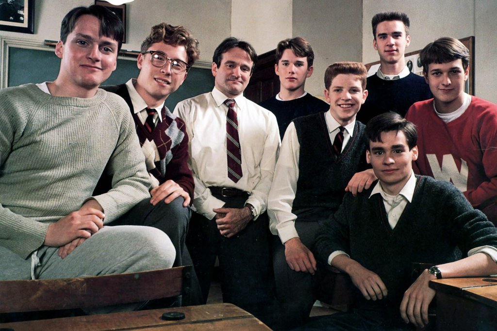 The main cast of Dead Poets' Society pose enthusiastically for an in-character promotional photo 