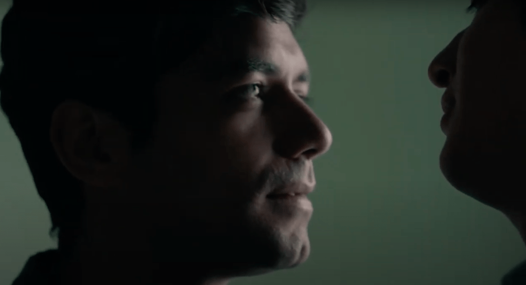 Closeup of Gerardo, staring at Iván's lips.