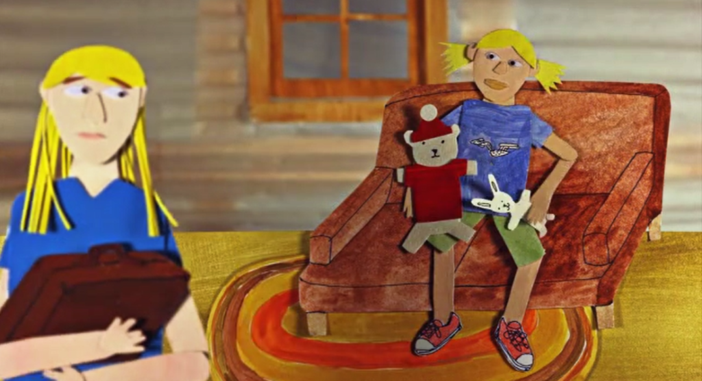 Still from 'Torrey Pines.' An animated image that appears as if it is made of cut out pieces of paper. A child sits on a couch playing with toys. An older woman is out of focus in the foreground.