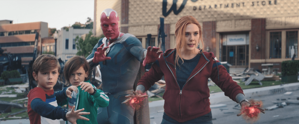 Wanda, Vision, and their children stand poised for battle on the streets of Westview