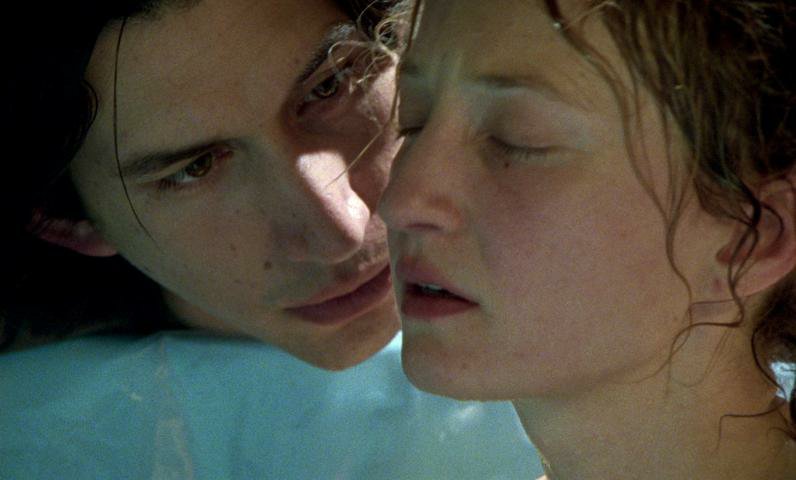 Jude stares pointedly at Mia, her eyes shut in clear anxiety 