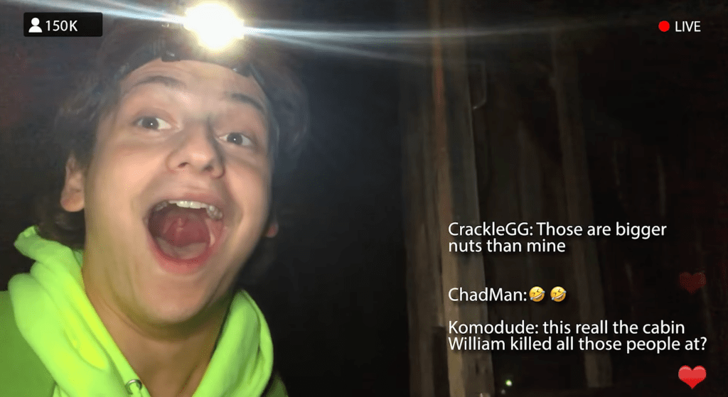 A still from Chad Gets the Axe showing Chad as he looks into the camera/his phone with a surprised facial expression. The still is framed as a live stream, with a viewing count to the upper left and a "LIVE" indicator to the upper right. To the right are three comments seen as well as a heart icon. The comments read the following: "CrackleGG: Those are bigger nuts than mine." "ChadMan: two crying-laughing emojis." "Komodude: this reall [really] the cabin William killed all those people at?"
