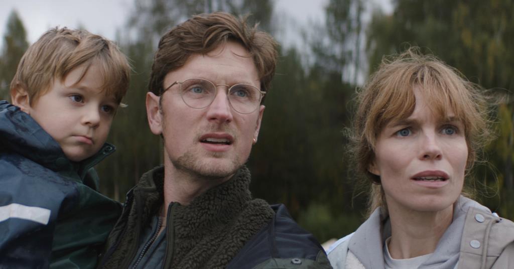 A family of three— Stine (Marie Bach Hansen), Teit (Mikkel Følsgaard), and Nemo (Mihlo Olsen) looking at something with bewildered expressions.